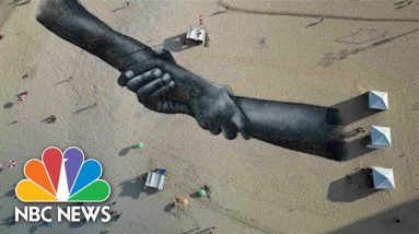 Artist Creates Giant Symbol Of Togetherness On Rio's Copacabana Beach