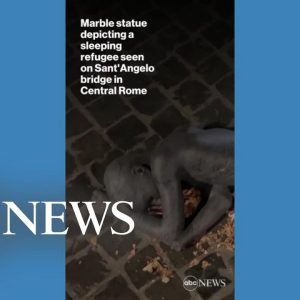 Marble statue depicting sleeping refugee installed in central Rome