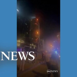 Fire races up high-rise near world's tallest building l ABC News