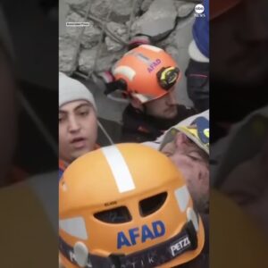 Emergency workers pull a man from the rubble of a collapsed building in Turkey after earthquake