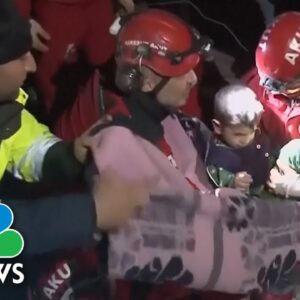 Video shows mom and young son saved from collapsed apartment