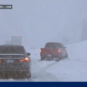 Storms on both coasts threaten holiday travel