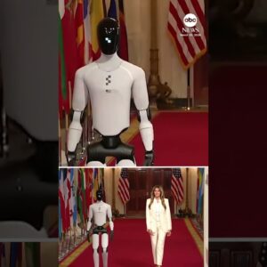 First lady Melania Trump walks with robot during White House technology summit