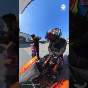 Motorcyclist lets girl rev bike for first time