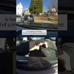 Officer hangs off truck before fatally shooting driver