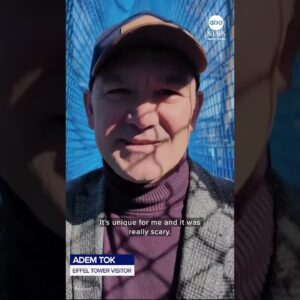 Tourists brave rope bridge suspended 200 feet up Eiffel Tower