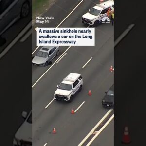 A massive sinkhole nearly swallows a car on the Long Island Expressway