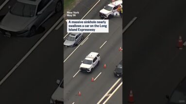 A massive sinkhole nearly swallows a car on the Long Island Expressway