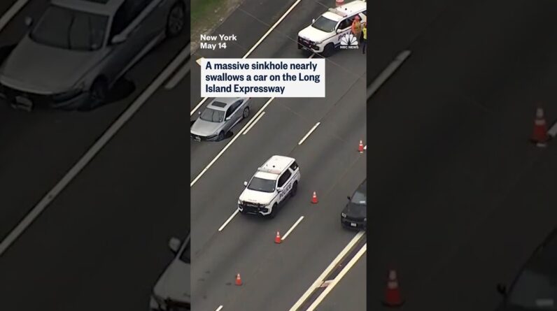 A massive sinkhole nearly swallows a car on the Long Island Expressway
