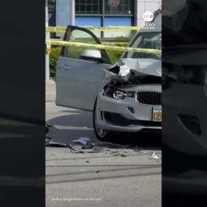 Motorcycle hangs from traffic light after crash