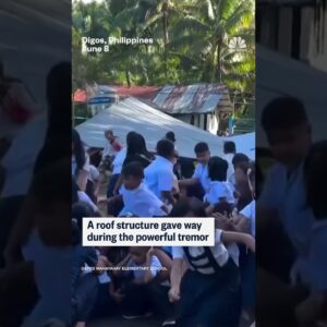 Students are rocked back and forth during 7.8-magnitude Philippines earthquake