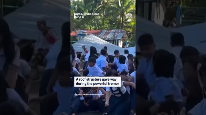 Students are rocked back and forth during 7.8-magnitude Philippines earthquake