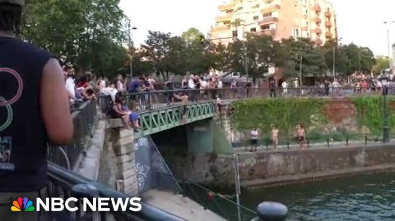 Europe heatwave: Watch Parisians jump into canal during NBC reporter's live shot