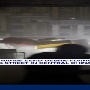 Powerful winds send debris flying down street in China